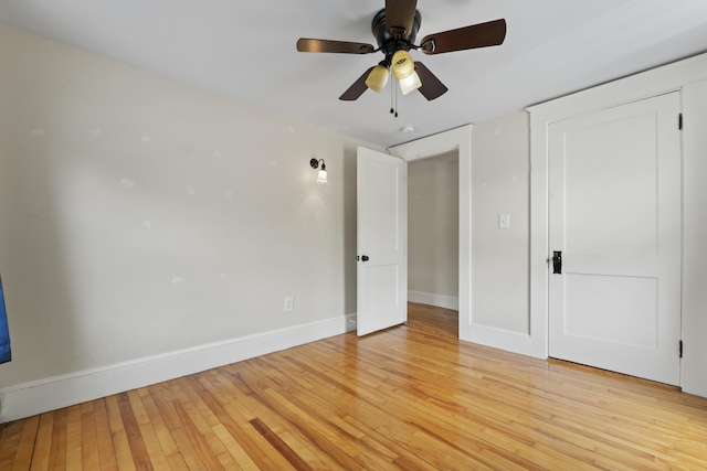 127 Lake St, Auburn, ME 04210 - unfurnished bedroom with baseboards, light wood finished floors, and ceiling fan