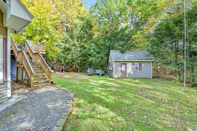 42 Lee Dr, Albion, ME 04910 - view of yard with stairway, an outbuilding, and a deck