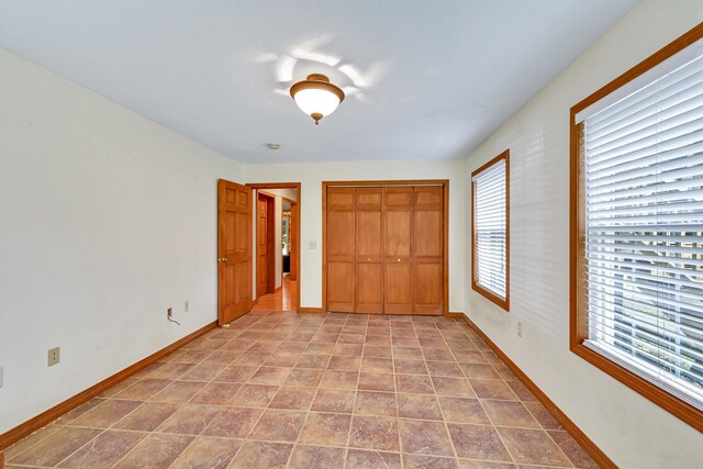 42 Lee Dr, Albion, ME 04910 - unfurnished bedroom with a closet and baseboards