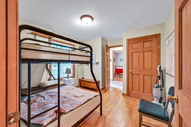 42 Lee Dr, Albion, ME 04910 - bedroom featuring light wood-type flooring and a textured ceiling