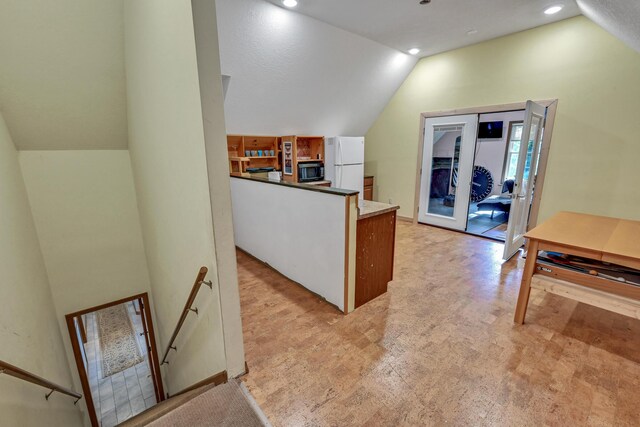 42 Lee Dr, Albion, ME 04910 - kitchen featuring lofted ceiling, black microwave, freestanding refrigerator, and recessed lighting