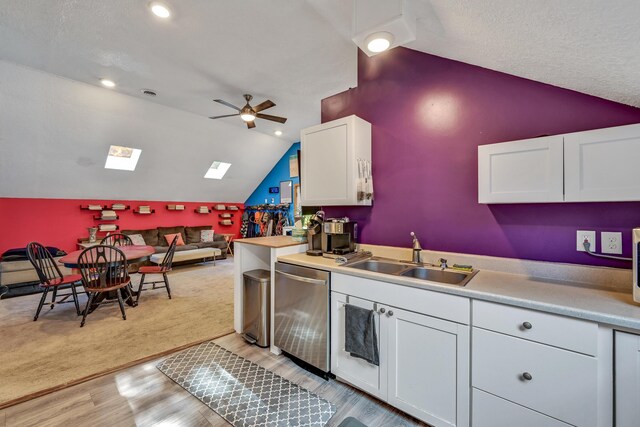 42 Lee Dr, Albion, ME 04910 - kitchen featuring a sink, vaulted ceiling, dishwasher, white cabinetry, and ceiling fan