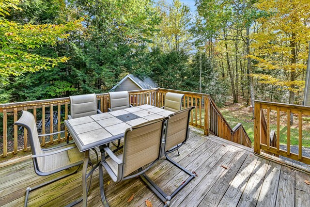 42 Lee Dr, Albion, ME 04910 - deck with outdoor dining space and an outbuilding