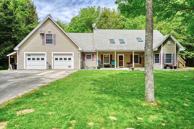 42 Lee Dr, Albion, ME 04910 - view of front facade featuring driveway, a shingled roof, a front yard, and covered porch