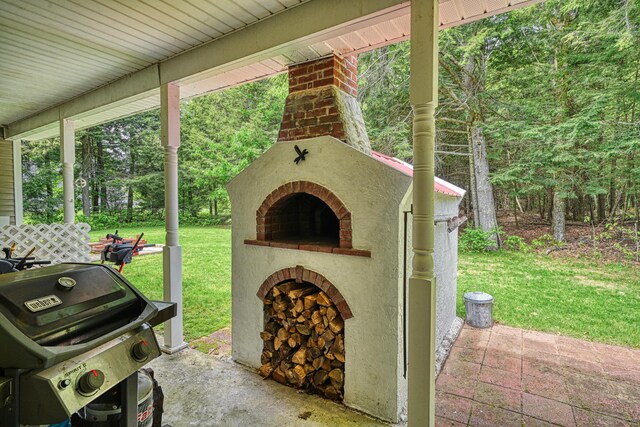 42 Lee Dr, Albion, ME 04910 - view of patio / terrace featuring an outdoor brick fireplace and area for grilling