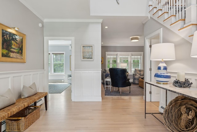 18 Forest Hill Ln, Kennebunk, ME 04043 - corridor with wainscoting, light wood-type flooring, ornamental molding, a baseboard radiator, and a decorative wall
