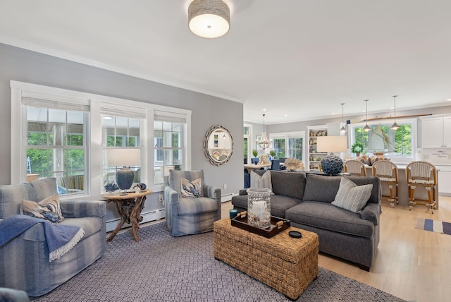 18 Forest Hill Ln, Kennebunk, ME 04043 - living area with light wood-type flooring, plenty of natural light, a baseboard radiator, ornamental molding, and recessed lighting