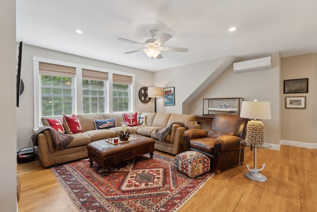 18 Forest Hill Ln, Kennebunk, ME 04043 - living area featuring an AC wall unit, ceiling fan, light wood finished floors, recessed lighting, and baseboards