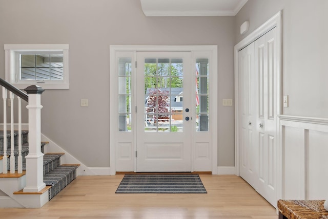 18 Forest Hill Ln, Kennebunk, ME 04043 - foyer with light wood-style floors, stairway, crown molding, and baseboards