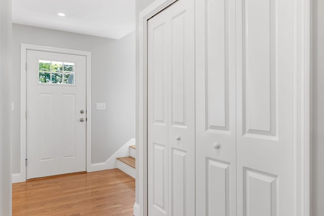 15 Essex St, Westbrook, ME 04092 - foyer entrance with light wood-style flooring, baseboards, stairs, and recessed lighting