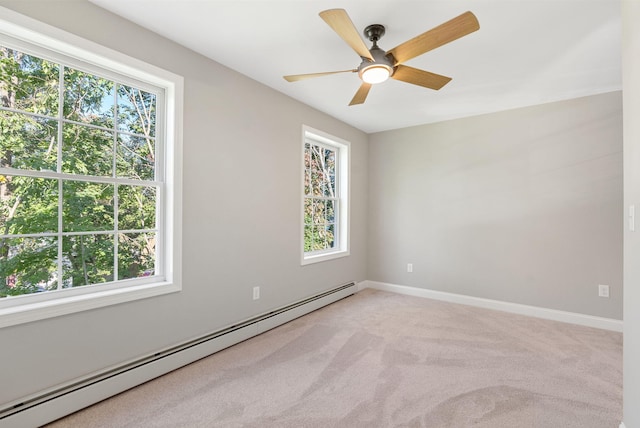 15 Essex St, Westbrook, ME 04092 - spare room featuring a baseboard radiator, healthy amount of natural light, light colored carpet, and baseboards