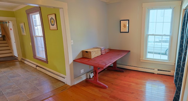 129 Libby St, Pittsfield, ME 04967 - dining room featuring crown molding, baseboard heating, stairs, and plenty of natural light