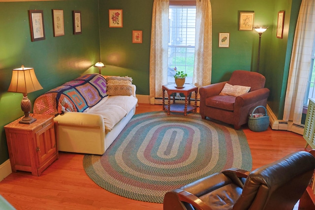 129 Libby St, Pittsfield, ME 04967 - living room with wood finished floors, baseboard heating, and baseboards
