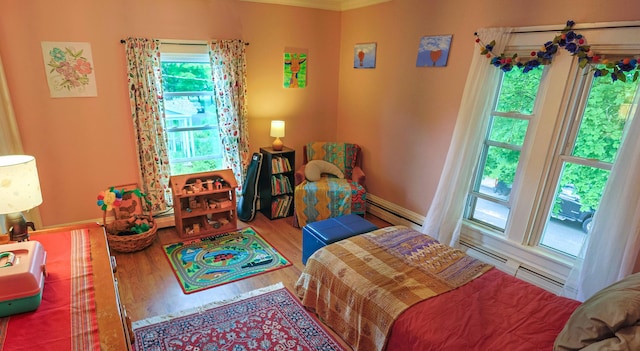 129 Libby St, Pittsfield, ME 04967 - bedroom featuring baseboard heating, wood finished floors, and baseboards