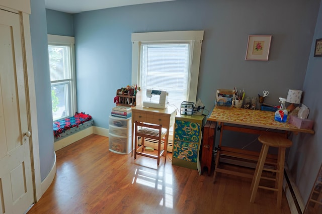 129 Libby St, Pittsfield, ME 04967 - office space featuring a baseboard heating unit, wood finished floors, and baseboards