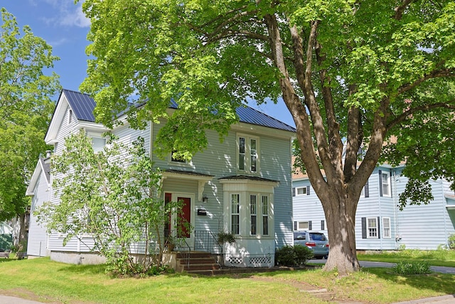 129 Libby St, Pittsfield, ME 04967 - view of front of property featuring metal roof and a front lawn
