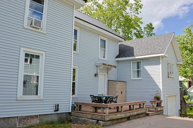 129 Libby St, Pittsfield, ME 04967 - back of property with cooling unit and a garage