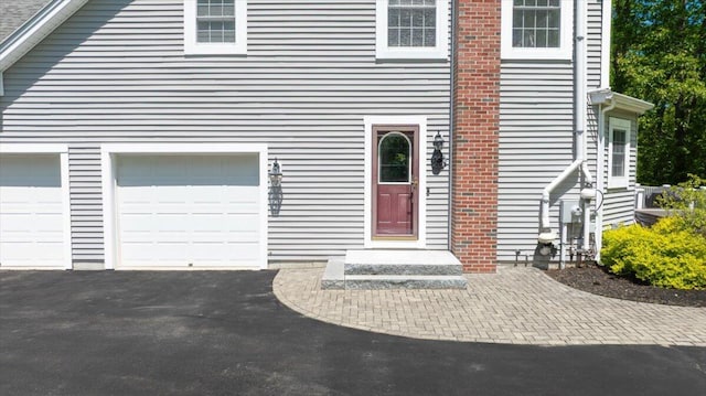 59 Sanderson Rd, Poland, ME 04274 - view of front facade with driveway and an attached garage