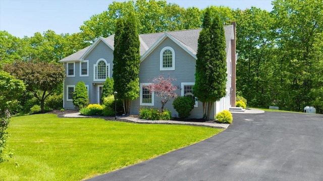 59 Sanderson Rd, Poland, ME 04274 - colonial home with a front lawn and a chimney