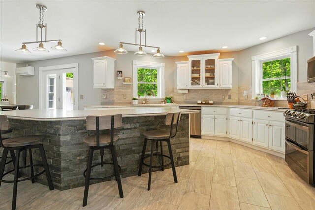 59 Sanderson Rd, Poland, ME 04274 - kitchen with appliances with stainless steel finishes, white cabinetry, tasteful backsplash, and recessed lighting