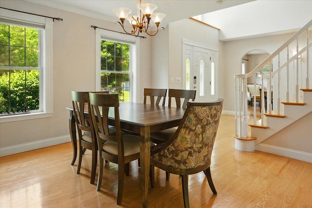 59 Sanderson Rd, Poland, ME 04274 - dining area featuring baseboards, a chandelier, light wood finished floors, and ornamental molding