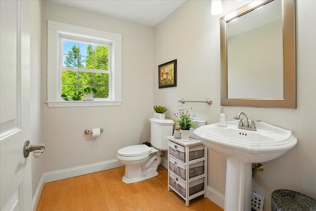 59 Sanderson Rd, Poland, ME 04274 - bathroom with toilet, wood finished floors, and baseboards