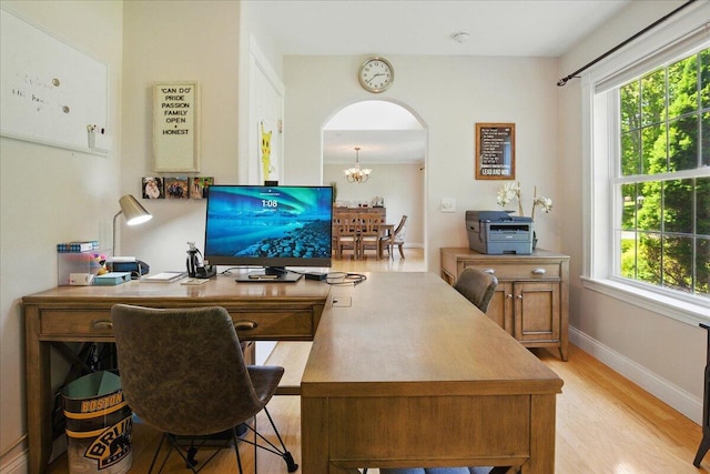 59 Sanderson Rd, Poland, ME 04274 - office featuring light wood-style floors, arched walkways, baseboards, and a chandelier