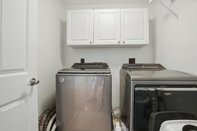 59 Sanderson Rd, Poland, ME 04274 - washroom featuring cabinet space and separate washer and dryer