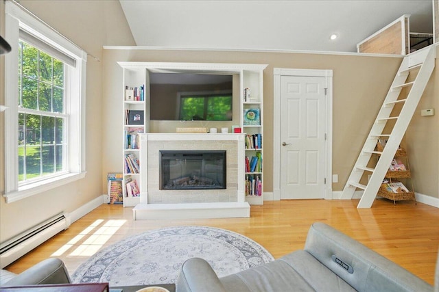 59 Sanderson Rd, Poland, ME 04274 - living room with a baseboard radiator, wood finished floors, baseboards, a glass covered fireplace, and recessed lighting