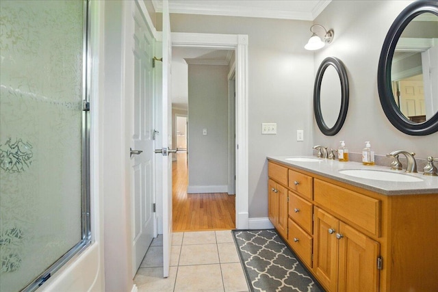 59 Sanderson Rd, Poland, ME 04274 - full bathroom with double vanity, ornamental molding, tile patterned flooring, baseboards, and shower / bath combination with glass door