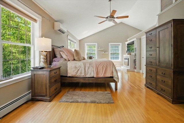 59 Sanderson Rd, Poland, ME 04274 - bedroom with a baseboard radiator, a wall mounted air conditioner, light wood-style floors, lofted ceiling, and a ceiling fan