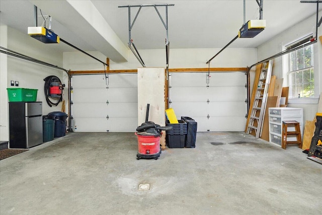59 Sanderson Rd, Poland, ME 04274 - garage featuring a garage door opener