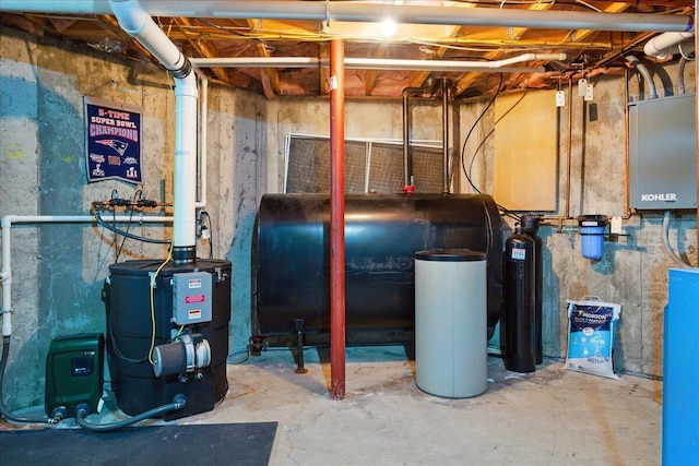 59 Sanderson Rd, Poland, ME 04274 - utility room featuring oil tank and a heating unit