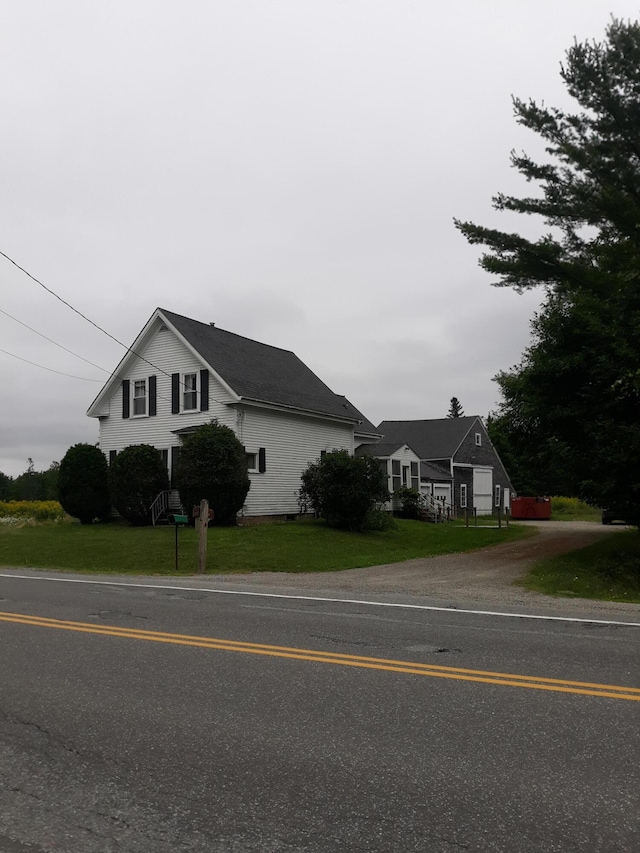 100 Bayside Rd, Ellsworth, ME 04605 - traditional home with a front lawn and dirt driveway