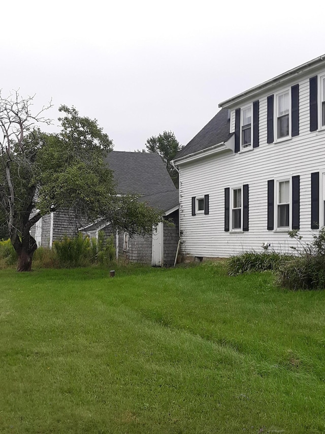 100 Bayside Rd, Ellsworth, ME 04605 - view of side of home featuring a yard