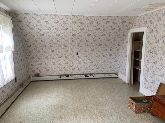 100 Bayside Rd, Ellsworth, ME 04605 - empty room featuring crown molding, a baseboard heating unit, and wallpapered walls