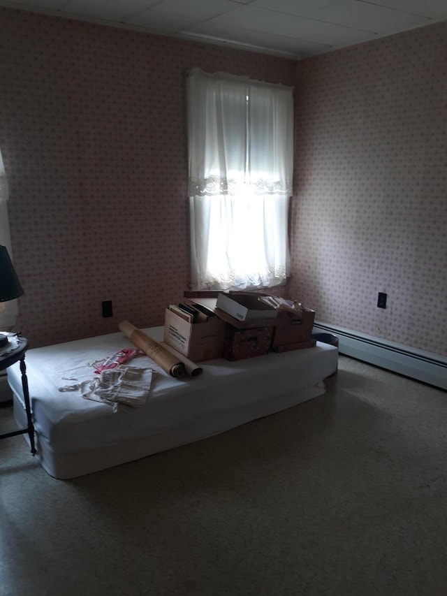 100 Bayside Rd, Ellsworth, ME 04605 - carpeted bedroom with wallpapered walls and a baseboard heating unit