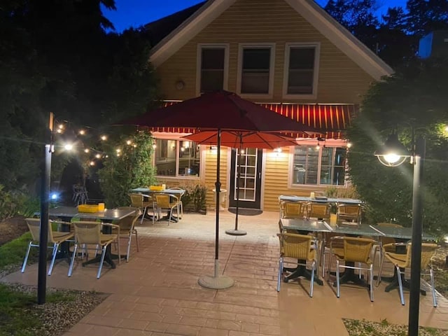 200 Shore Rd, Ogunquit, ME 03907 - back of house at twilight with outdoor dining area and a patio area