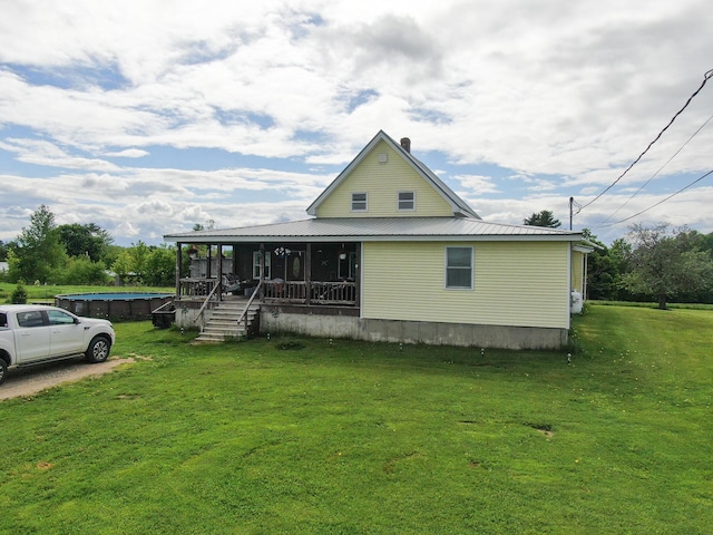 164 Mud Pond Road, Prentiss Twp T7 R3 Nbpp, ME 04487 - view of front of house featuring a front lawn, a porch, and metal roof