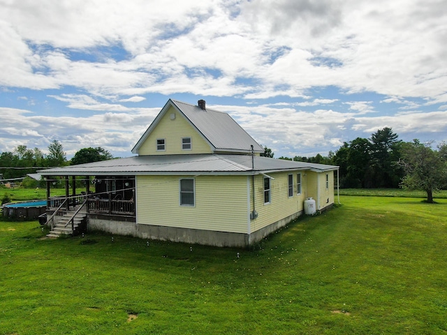 164 Mud Pond Road, Prentiss Twp T7 R3 Nbpp, ME 04487 - view of side of property featuring a yard and metal roof