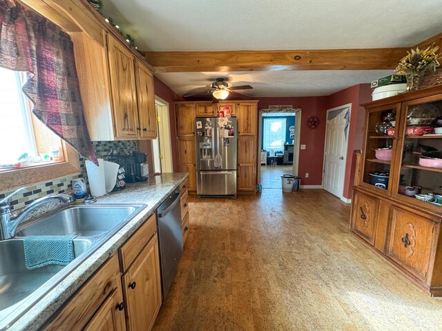 164 Mud Pond Road, Prentiss Twp T7 R3 Nbpp, ME 04487 - kitchen featuring stainless steel appliances, brown cabinetry, a sink, plenty of natural light, and beamed ceiling
