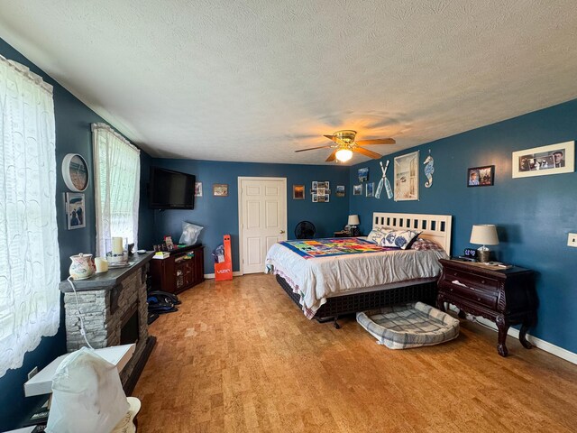164 Mud Pond Road, Prentiss Twp T7 R3 Nbpp, ME 04487 - carpeted bedroom with a textured ceiling, baseboards, and a ceiling fan