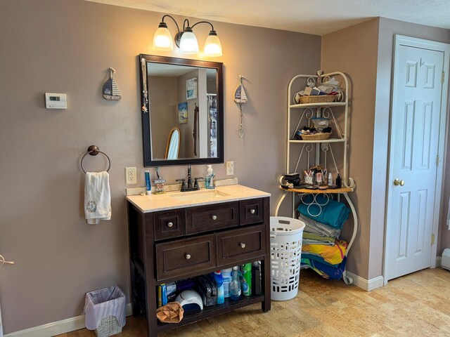 164 Mud Pond Road, Prentiss Twp T7 R3 Nbpp, ME 04487 - bathroom featuring vanity, wood finished floors, and baseboards
