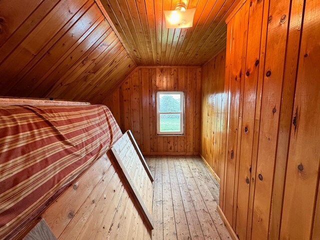 164 Mud Pond Road, Prentiss Twp T7 R3 Nbpp, ME 04487 - bedroom featuring wood ceiling, wood walls, lofted ceiling, and light wood-style floors