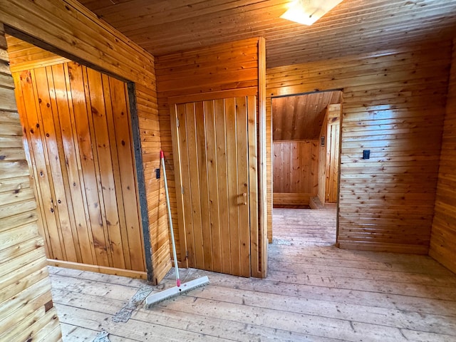 164 Mud Pond Road, Prentiss Twp T7 R3 Nbpp, ME 04487 - hallway featuring wood-type flooring, wooden walls, and wooden ceiling