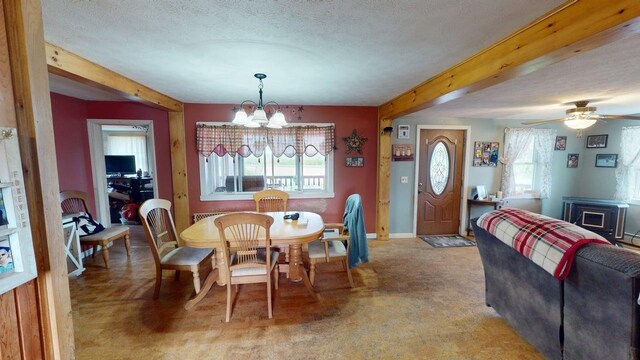 164 Mud Pond Road, Prentiss Twp T7 R3 Nbpp, ME 04487 - dining room featuring beam ceiling, a chandelier, a textured ceiling, ceiling fan, and baseboards