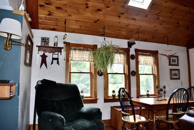 10 Rines Rd, Burnham, ME 04922 - dining room with lofted ceiling, healthy amount of natural light, a skylight, wooden ceiling, and baseboards