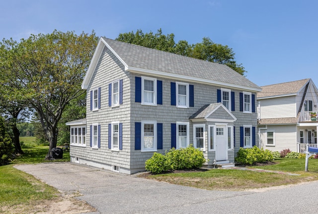 116 Hills Beach Rd, Biddeford, ME 04005 - colonial inspired home with roof with shingles, a front yard, and entry steps
