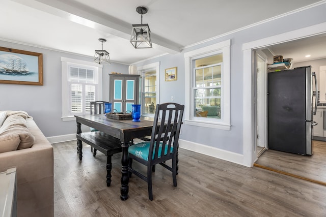116 Hills Beach Rd, Biddeford, ME 04005 - dining room with french doors, healthy amount of natural light, wood finished floors, and crown molding