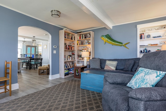 116 Hills Beach Rd, Biddeford, ME 04005 - living area with arched walkways, crown molding, and wood finished floors